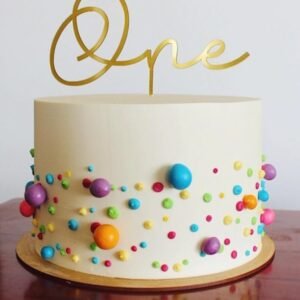 White cake with colourfull balls