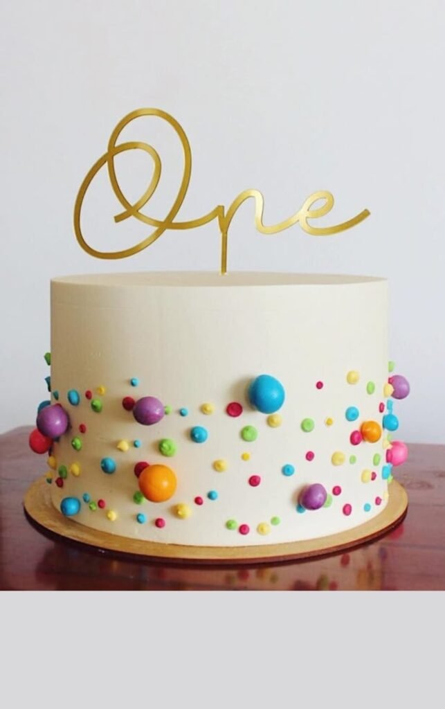 White cake with colourfull balls
