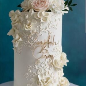 White tall cake with flower