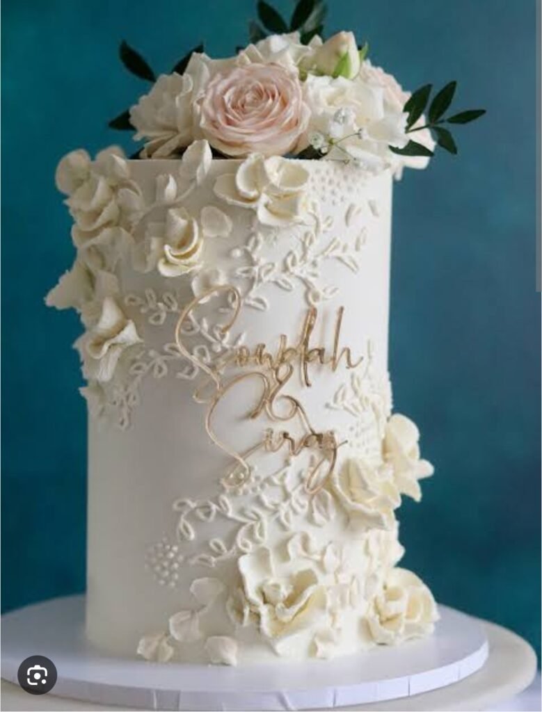 White tall cake with flower