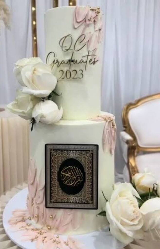 Two tier white quran theme cake with white flowers