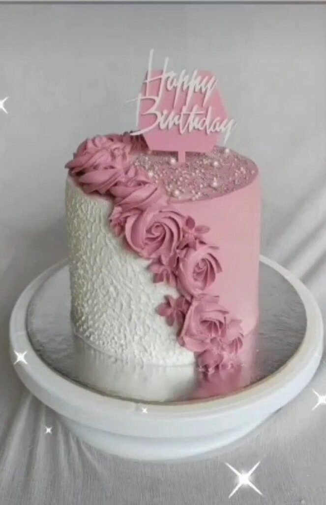 Pink and white cake with pink flowers and pearls