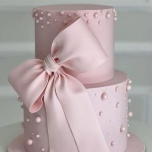 Pink cake with pink bow and pearls