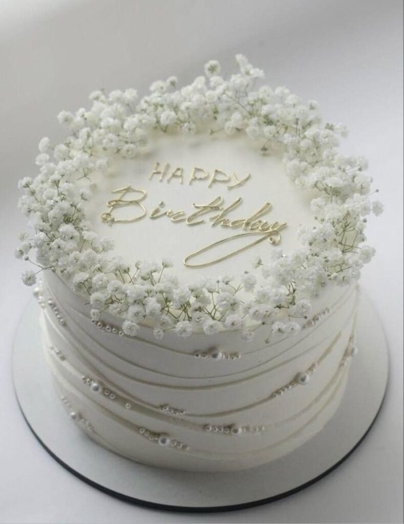 White baby breath birthday cake