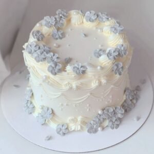 Off white cake with grey fondant flowers