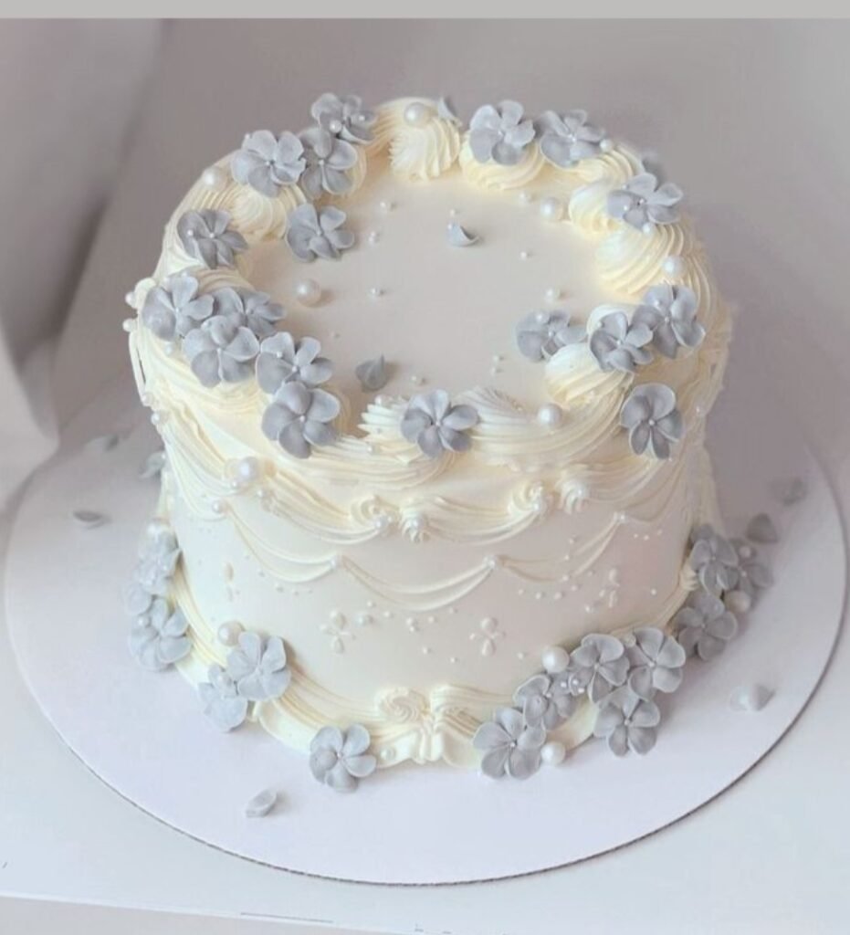 Off white cake with grey fondant flowers