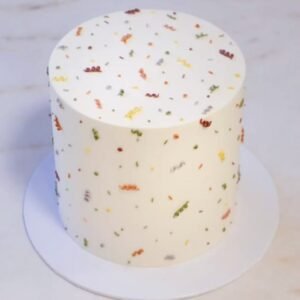 White cake with colorful mosaic design