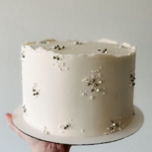 Cake with clustered white and black beads