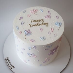 Heighted white cake with random colorful designs