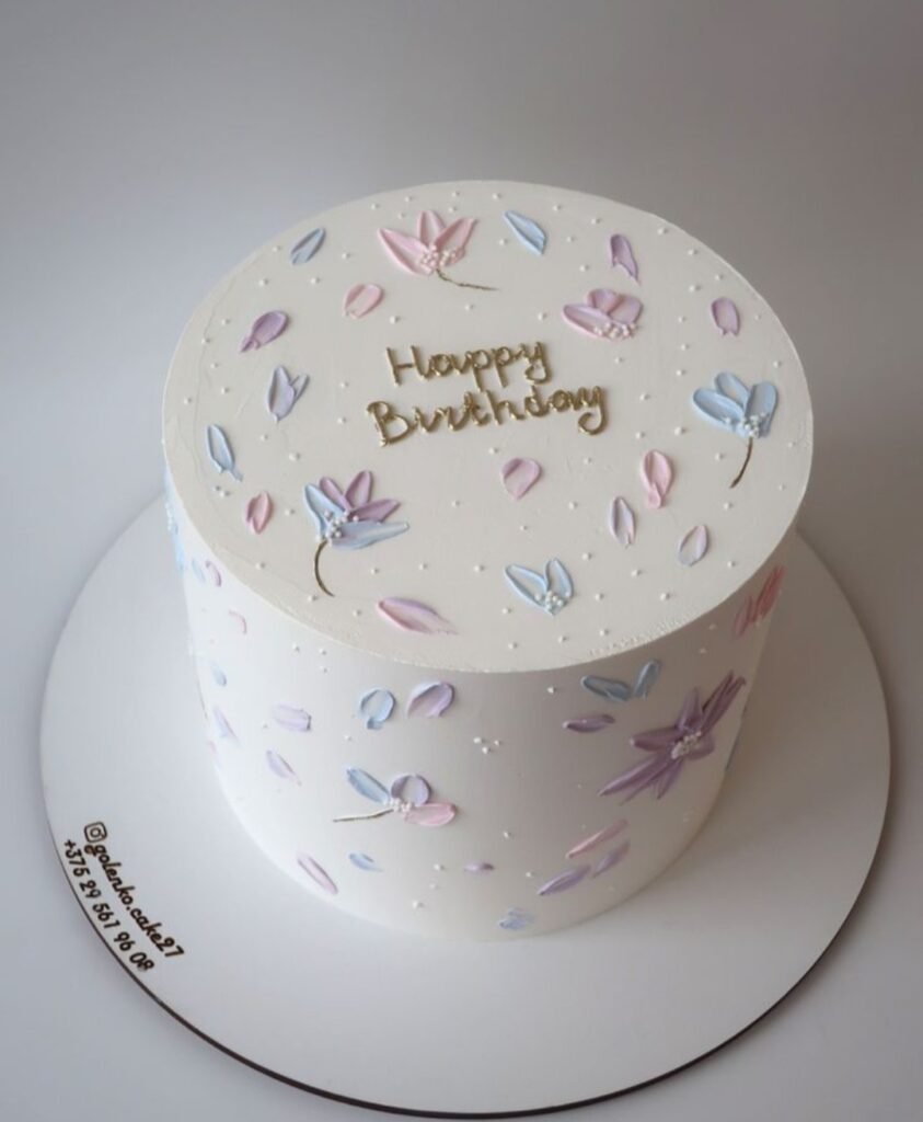 Heighted white cake with random colorful designs
