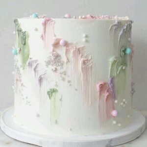 White cake with pearls and painting