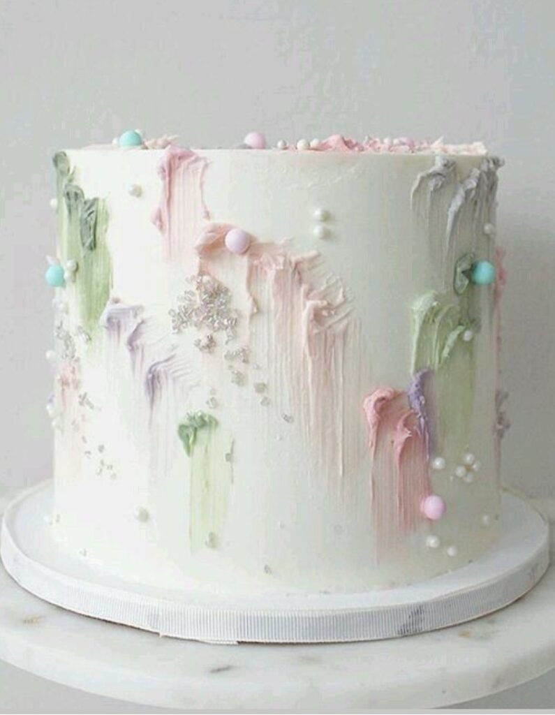 White cake with pearls and painting