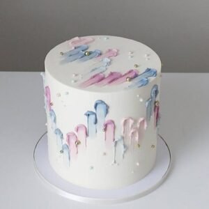 Tall pink cake with finger paints