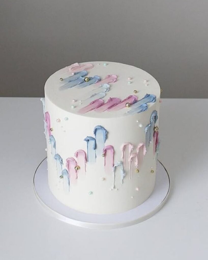 Tall pink cake with finger paints