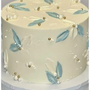 White cake with beads and leafs