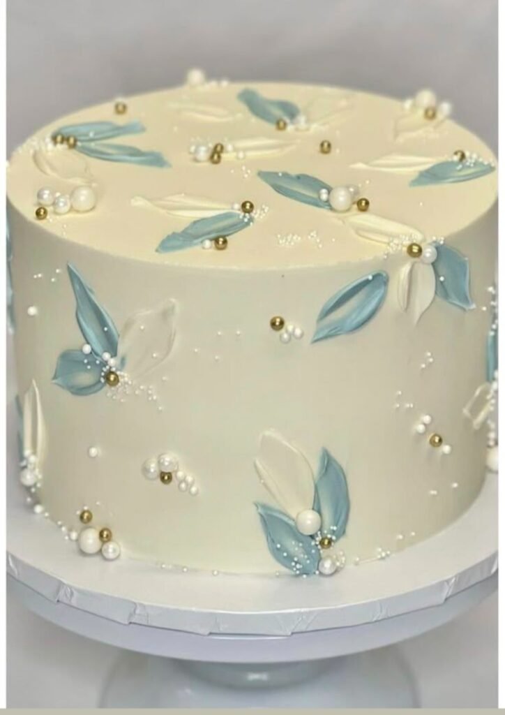 White cake with beads and leafs