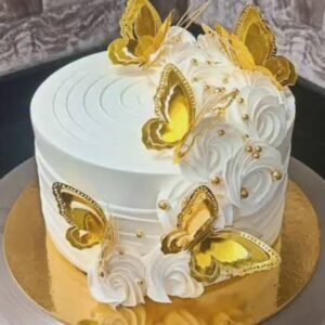 White cake with golden butterflies