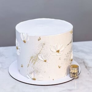 White cake with gold sprinkles