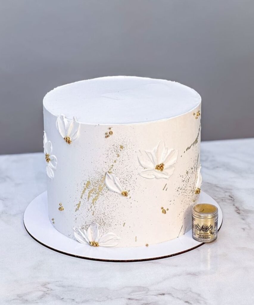White cake with gold sprinkles