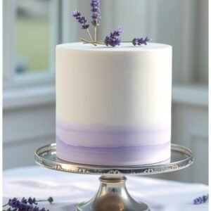 Simple white cake with purple bottom and purple flowers