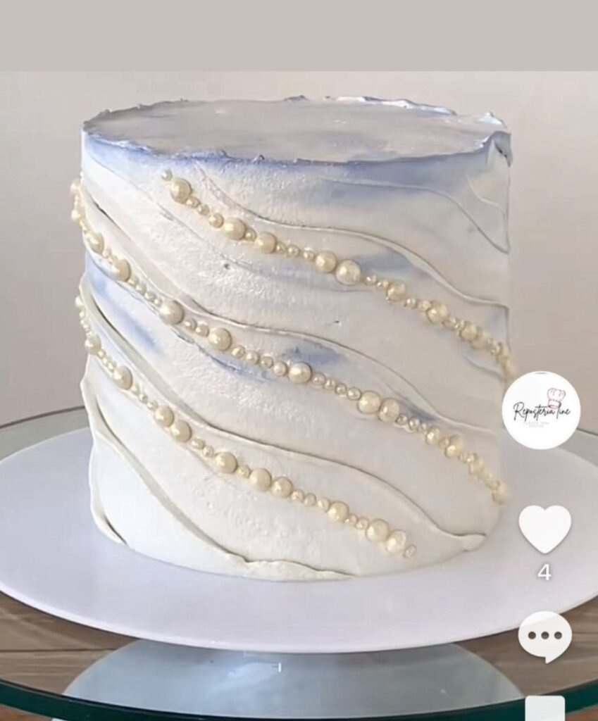 Shiny white cake with diagonal beads lines