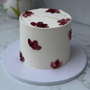 White cake with red petals