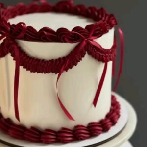 White cake with red lace