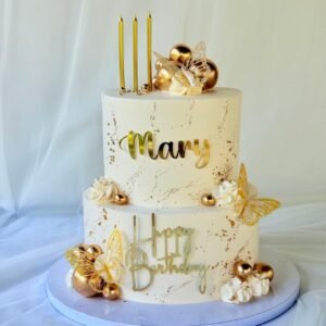 White and golden double tier birthday cake