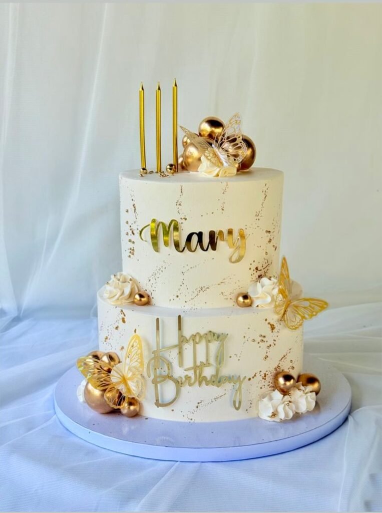 White and golden double tier birthday cake