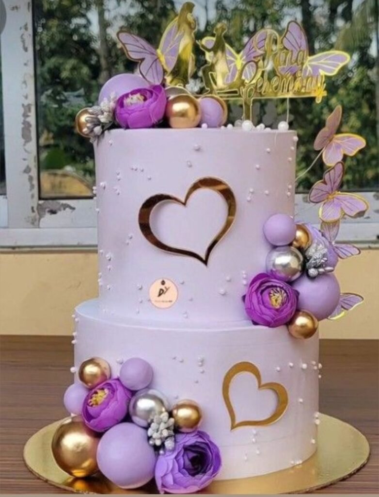Double tier purple theme cake