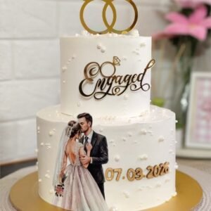 Two tier white engagement cake