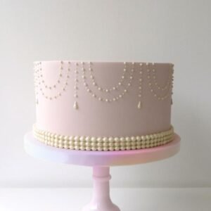 Pink cake with necklace style lace