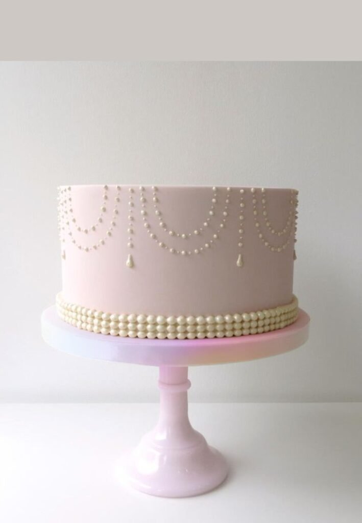 Pink cake with necklace style lace