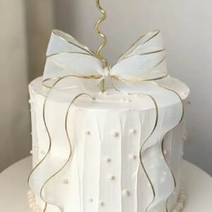 White cake with white lace bow