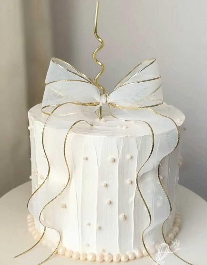 White cake with white lace bow