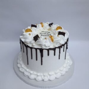 White cake with coin and chocolate dip