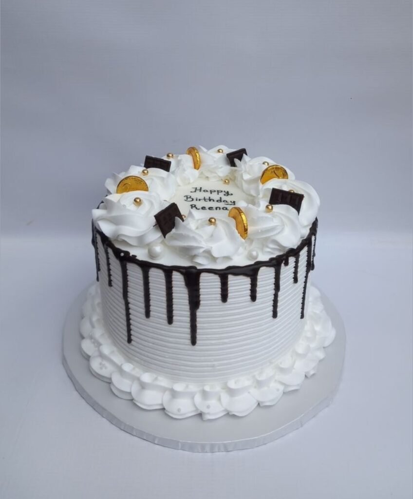 White cake with coin and chocolate dip